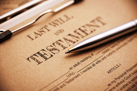 Silver pen on top of a legal document titled last will and testament